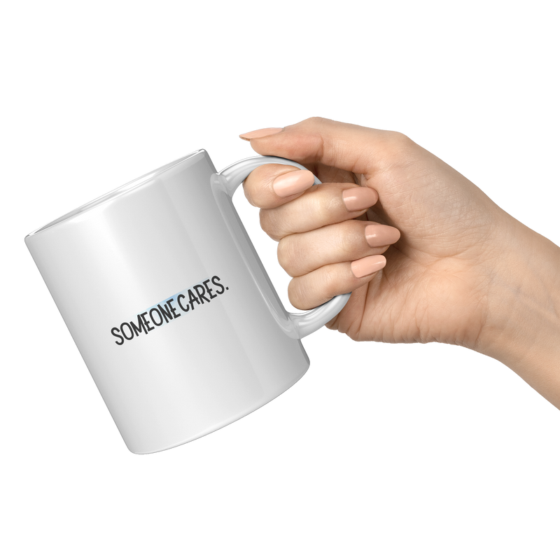 Someone_Cares__11_oz_Mug_11oz_White_RH_Model_Mockup.png